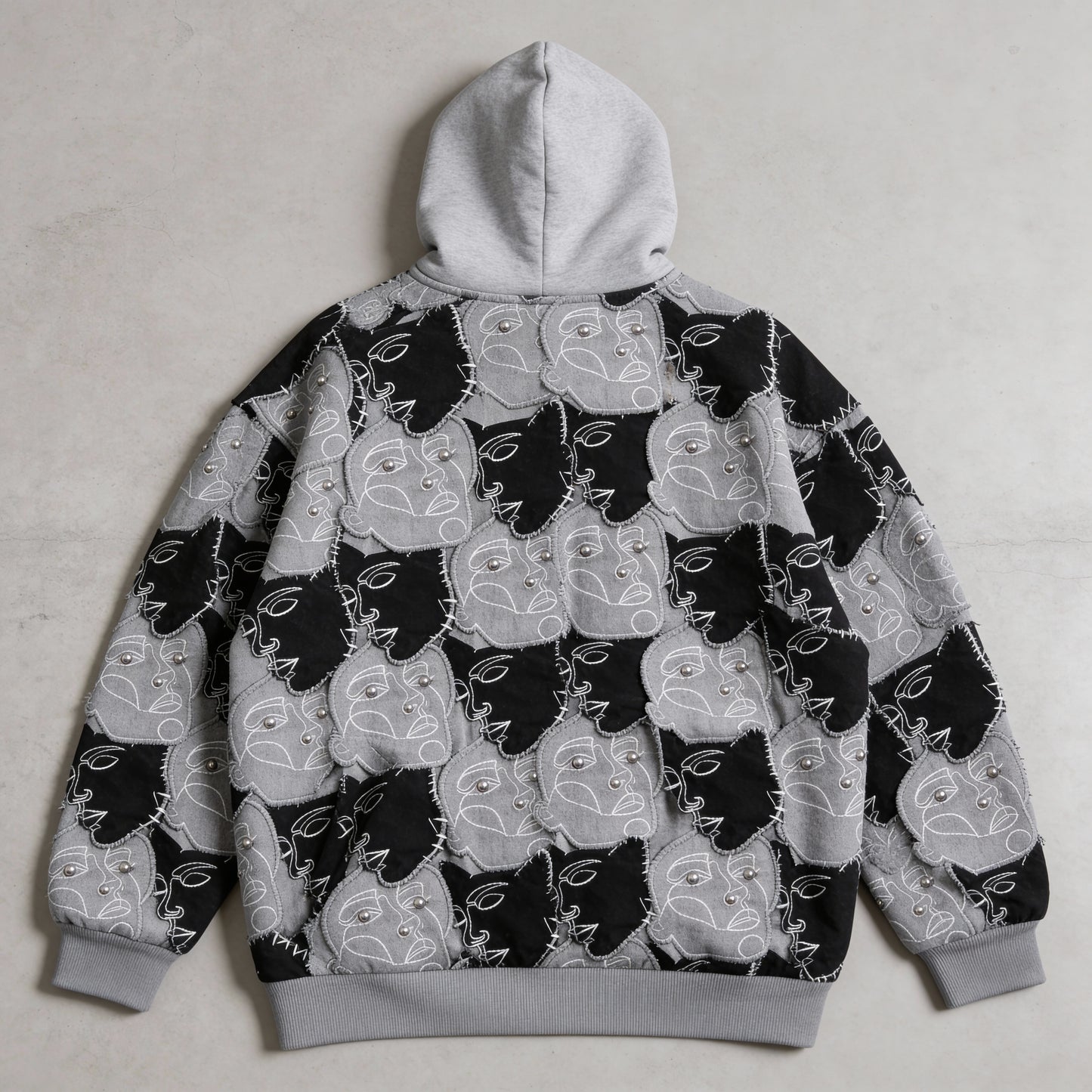 "Faces," oversized cotton hoodie